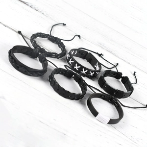 Detail of 6-piece men's punk black leather woven bracelets with adjustable cords