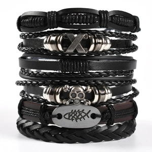 Mens punk multi-layer leather bracelet set with owl wing and skull charms on white background
