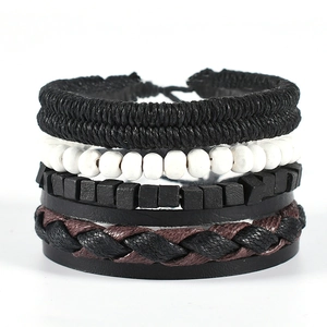 Close-up of multilayer men's woven bracelet with leather straps and matte beads