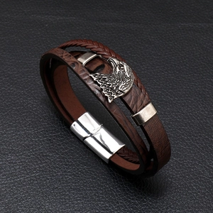 Men's braided brown leather bracelet with silver eagle charm and magnetic clasp closure