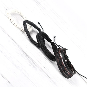 Detail view of a 4-piece vintage leather and bead bracelet set for men and women
