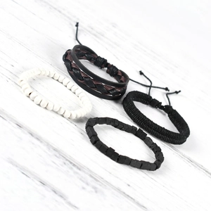 Macro view of men's vintage multi-layer bracelet set with leather and beads details