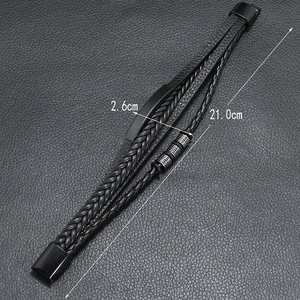 Macro shot of multilayer woven leather bracelet for men featuring silver cross-pattern beads