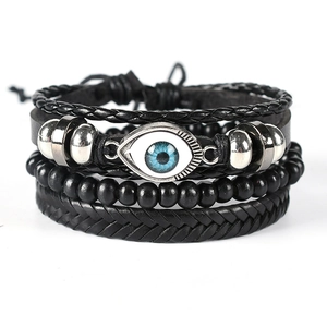 Multilayer leather bracelet set featuring woven cords, black beads, and blue Evil Eye charm