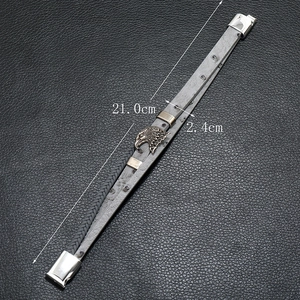 Detailed view of woven grey leather men's bracelet with eagle head clasp and 21cm size mark