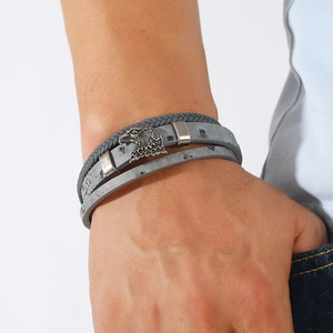 Detail view of men's gray woven leather bracelet featuring a silver eagle alloy magnetic clasp