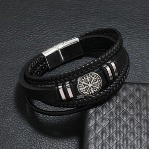 Detail of multi-layer woven leather bracelet with Viking compass and magnetic clasp