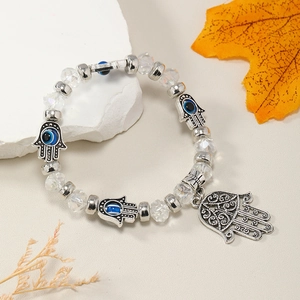 Pulsera de cuentas Mano de Fátima y Ojo Turco con cristales en un decorado otoñal