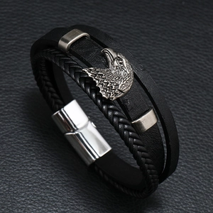 Men's braided black leather bracelet featuring a silver eagle charm and magnetic clasp