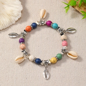 Bohemian ocean style colorful beaded bracelet with natural shells and silver pendants