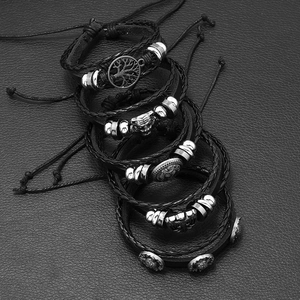 Men's multilayer leather bracelet set with skull and lion head charms in punk style