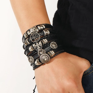 Close-up of punk leather bracelet stack with tiger, lion, and eagle silver alloy charms