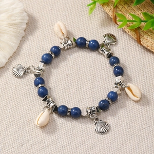 Bohemian ocean style bracelet with dark blue matte beads and natural white seashells