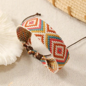 Handmade Bohemian woven friendship bracelet with colorful geometric patterns and slide knot