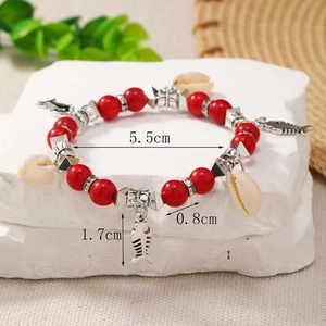 Detail view of Bohemian shell bracelet with fishbone charms and sizing measurements