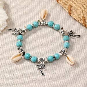 Bohemian ocean style beaded bracelet with turquoise stones, shells and palm tree charms