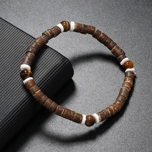 Bracelet fait main en écorce de coco et turquoise avec intercalaires en coquillage naturel