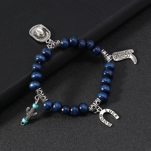 Western cowboy style beaded bracelet set with blue wooden beads and silver lucky charms