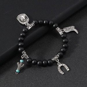 Western cowboy style multi-layer beaded bracelet with matte black beads and silver charms