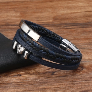 Detail of multi-layer braided leather men bracelet with blue and black woven cords