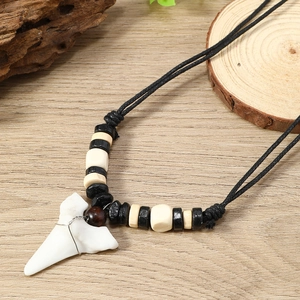 Bohemian shark tooth necklace with wood beads and tribal charms for summer surfing