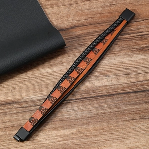 Bracelet multicouche en cuir tressé style punk avec motifs têtes de mort et fermoir