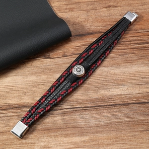 Detailed view of multilayer leather bracelet with silver compass charm and magnetic clasp