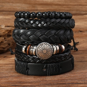 Detailed macro view of 6-piece multilayer men's leather bracelets with silver floral charms