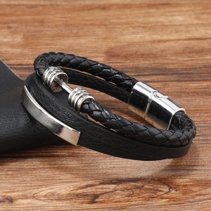 Detail of multi-layer black leather bracelet with stainless steel beads and magnetic clasp