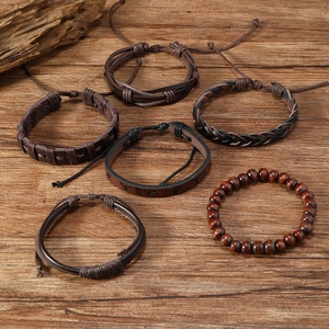 Close-up of 6-piece men's leather bracelet set with bull head charm and wood beads