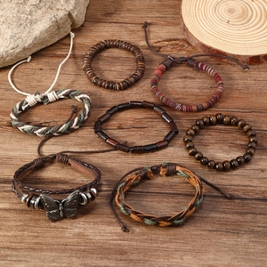 7-piece set of vintage braided leather and wood bead bracelets with butterfly charm