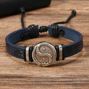 Braided leather bracelet for men featuring dragon and yin yang engraved metal disc