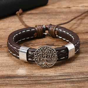Handmade woven leather bracelet for men featuring a vintage Tree of Life metal charm