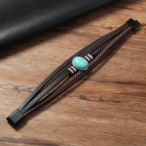 Macro shot of vintage multilayer leather bracelet with blue turquoise stone and magnetic clasp