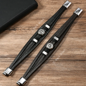 Detail view of men's leather bracelet showing size measurements and magnetic compass clasp