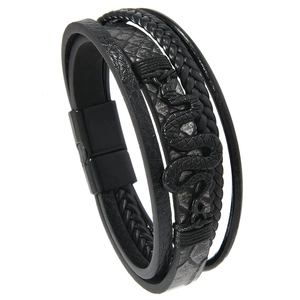 Detail of multi-layer black braided leather bracelet with metal snake charm and magnetic clasp