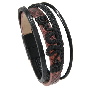 Detail of multi-layer leather bracelet with brown snakeskin pattern and black snake charm