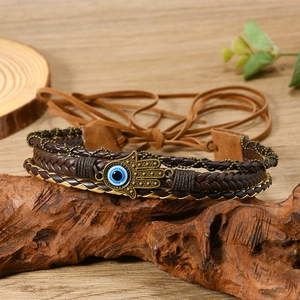 Bohemian multilayer leather bracelet with bronze Hamsa Hand and Evil Eye charm