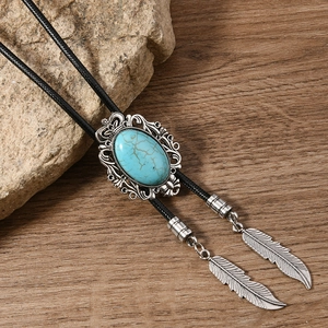 Vintage western bolo tie with blue turquoise and silver metal feather pendants