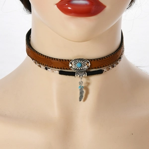 Detail view of bohemian double-layer choker with feather pendant and turquoise stone