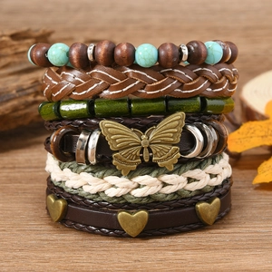 Detail of bohemian multilayer bracelet set with turquoise beads and wood charms