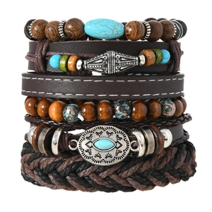 Detail of bohemian multilayer bracelet set with wood beads and retro metal charms