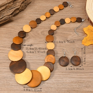 Detail of bohemian wooden jewelry set with circular pendants on rustic wood background