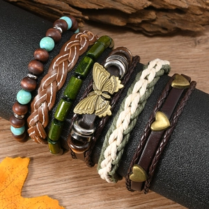 Detail of 6-piece bohemian bracelet set with turquoise beads and butterfly charms