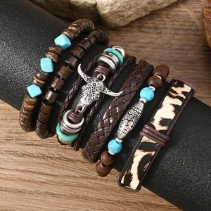 Detail view of multi-layer Bohemian bracelets with wooden beads and bull head pendant