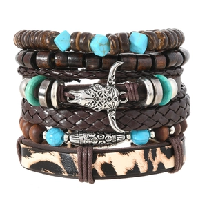 Detail of bohemian multilayer bracelet with wooden beads, bull head pendant and leopard print