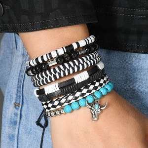 Detail of 6-piece bohemian stackable bracelets with blue turquoise and bull head charm