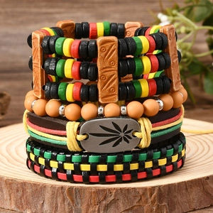 Detail of bohemian multilayer bracelet set with hemp leaf metal charm and colorful beads