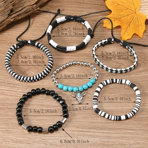 Close-up of bohemian 6-piece bracelet set with turquoise charms and woven textures