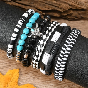 Detail of 6-piece bohemian bracelet set with turquoise beads, leather and bull skull charm
